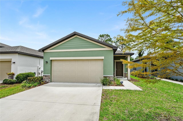 view of front facade with a front yard and a garage