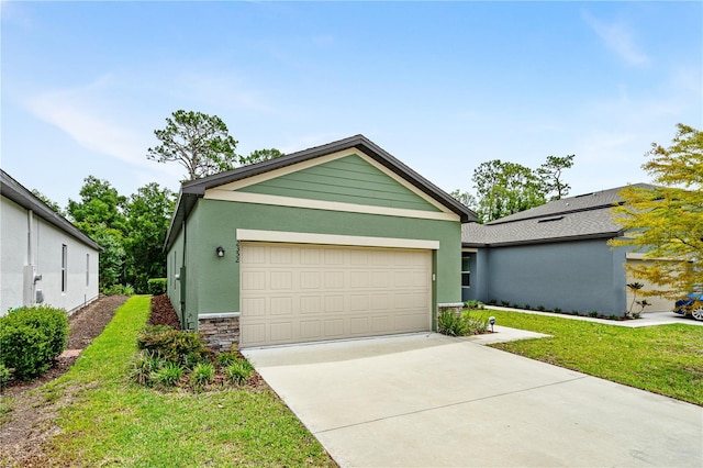 single story home with a front lawn and a garage