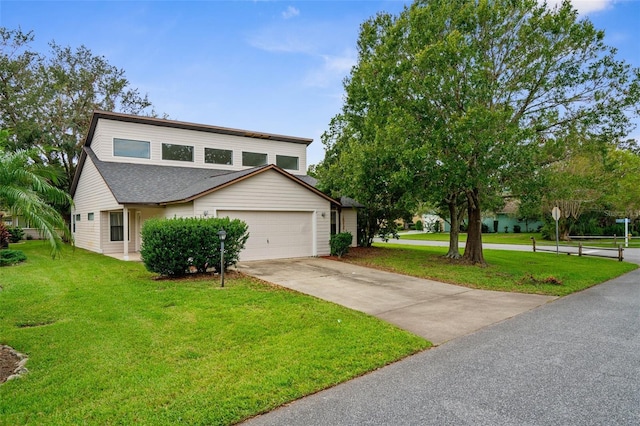 172 Gull Dr S, Daytona Beach, FL 32119 - view of front facade with driveway, an attached garage, a front yard, and a shingled roof