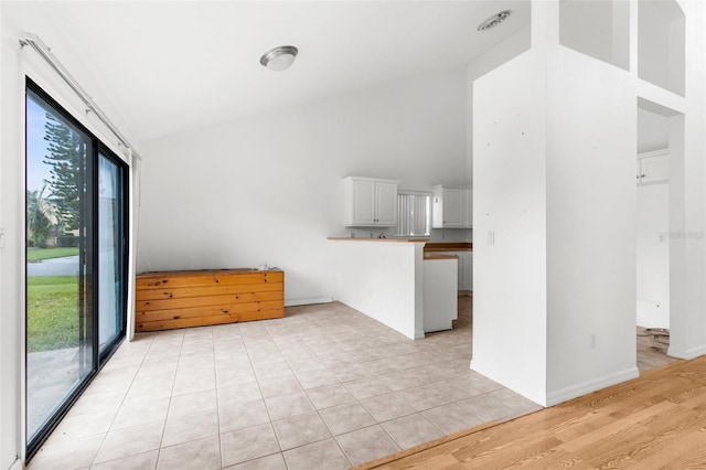 172 Gull Dr S, Daytona Beach, FL 32119 - unfurnished living room featuring high vaulted ceiling