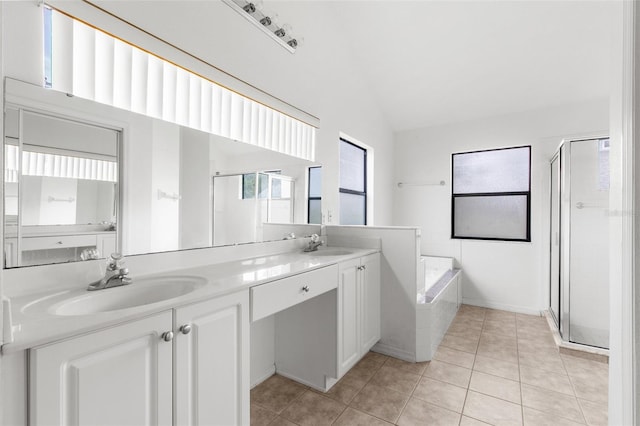 bathroom with vanity, vaulted ceiling, separate shower and tub, and tile patterned flooring