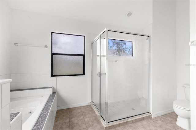 bathroom with plus walk in shower, toilet, and tile patterned flooring