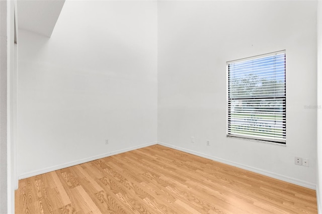 spare room featuring light wood-type flooring