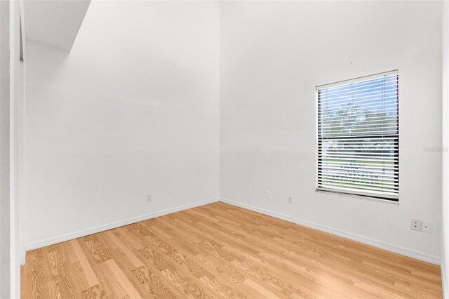 172 Gull Dr S, Daytona Beach, FL 32119 - empty room with light wood-type flooring and baseboards