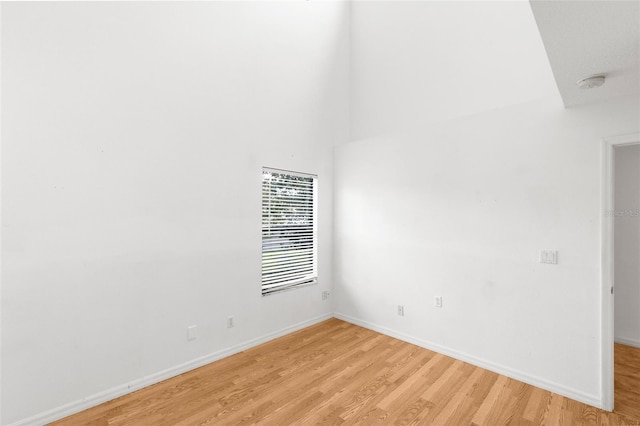 spare room with light hardwood / wood-style flooring