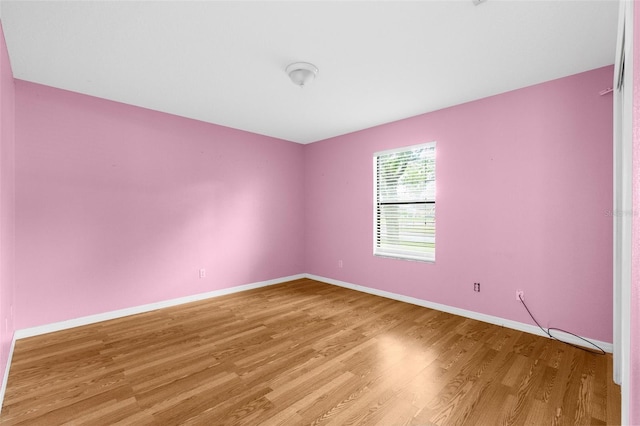 unfurnished room featuring light wood-type flooring