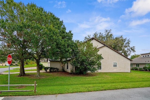 view of home's exterior featuring a yard