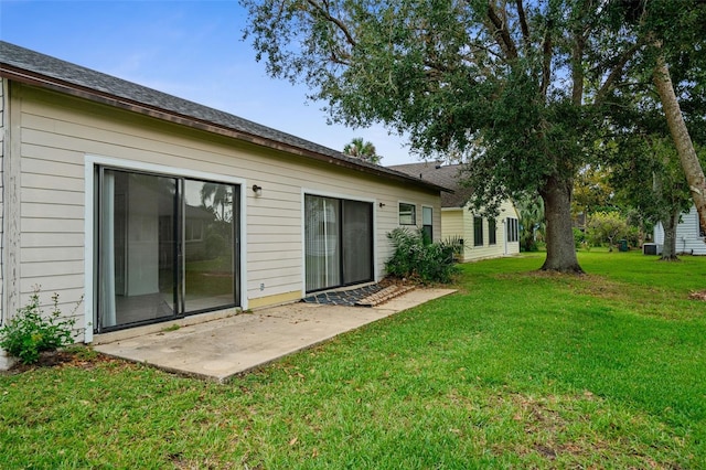 rear view of house with a lawn