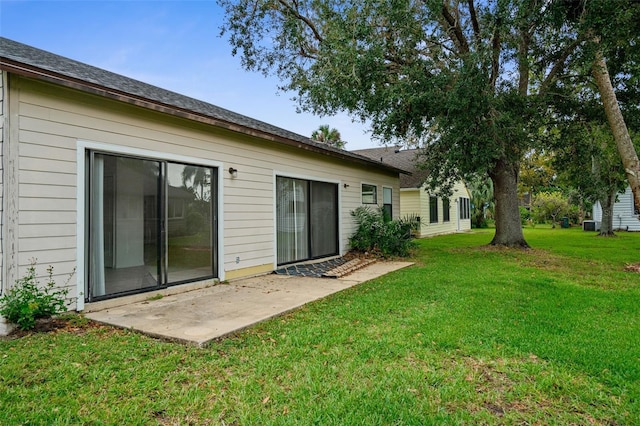 172 Gull Dr S, Daytona Beach, FL 32119 - rear view of property featuring a patio area and a yard