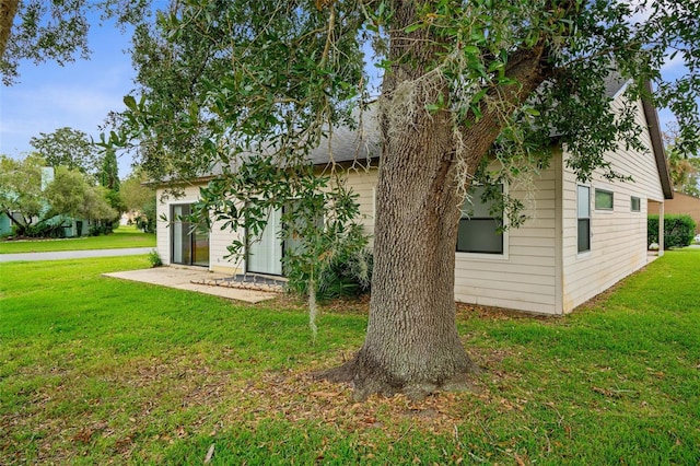 rear view of house with a yard