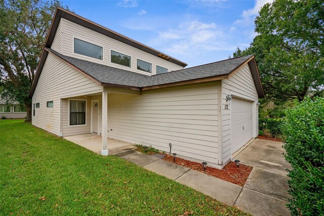 172 Gull Dr S, Daytona Beach, FL 32119 - view of front of property with a shingled roof, a front yard, driveway, and an attached garage