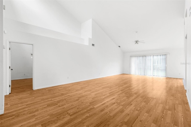 unfurnished living room featuring high vaulted ceiling, light wood-type flooring, and ceiling fan