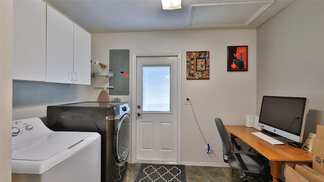 clothes washing area with electric panel, independent washer and dryer, and cabinets