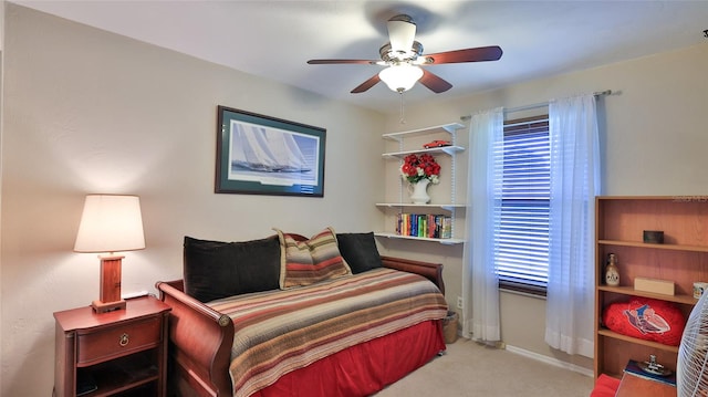 bedroom with light carpet, multiple windows, and ceiling fan