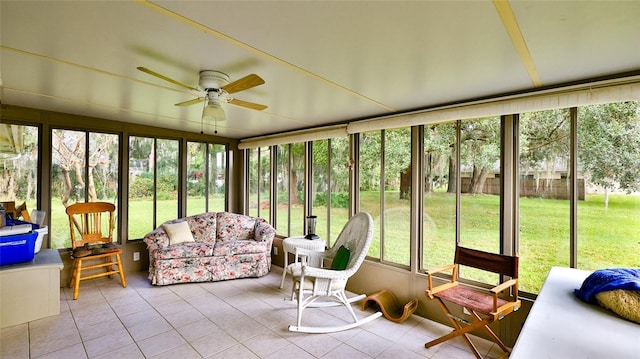 sunroom with ceiling fan and a healthy amount of sunlight