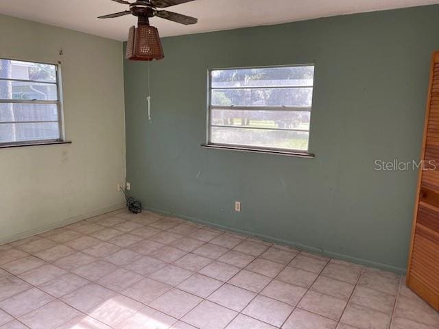 spare room with ceiling fan