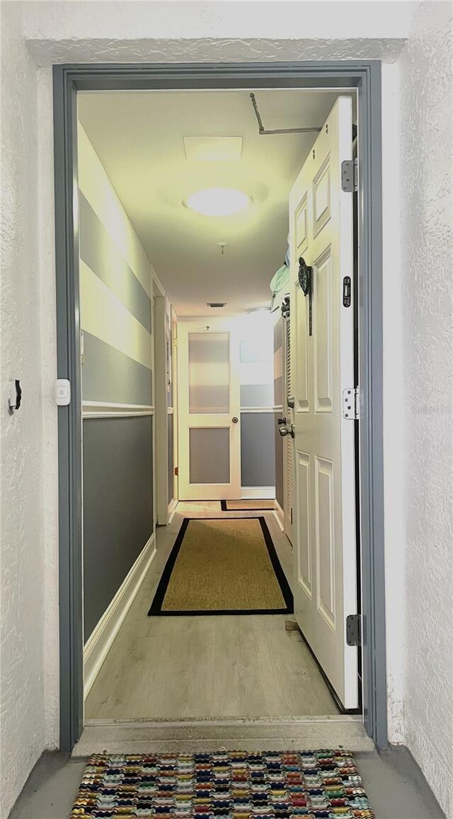 5207 S Atlantic Ave Unit 0622, New Smyrna Beach, FL 32169 - hallway featuring a textured wall