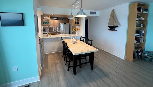 dining area featuring dark hardwood / wood-style flooring