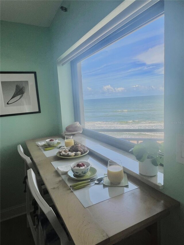 dining space with a water view