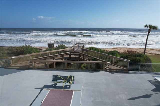 5207 S Atlantic Ave Unit 0622, New Smyrna Beach, FL 32169 - view of patio featuring a water view and a view of the beach