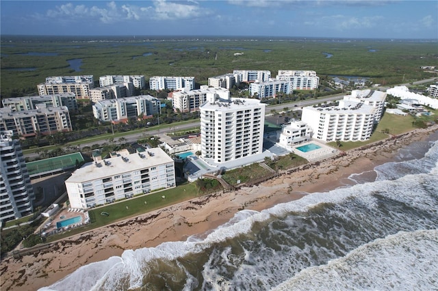 bird's eye view with a water view and a view of the beach