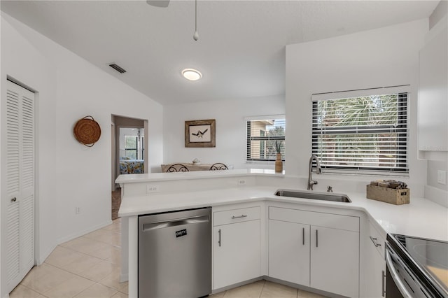 kitchen featuring lofted ceiling, sink, white cabinetry, and stainless steel appliances