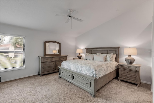 bedroom featuring light carpet, vaulted ceiling, and ceiling fan