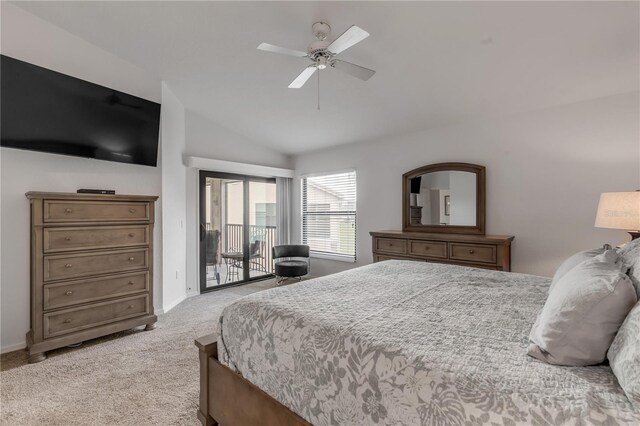 carpeted bedroom featuring access to exterior, vaulted ceiling, and ceiling fan