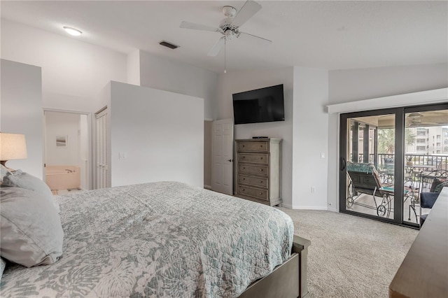 carpeted bedroom with ceiling fan, high vaulted ceiling, ensuite bath, and access to exterior