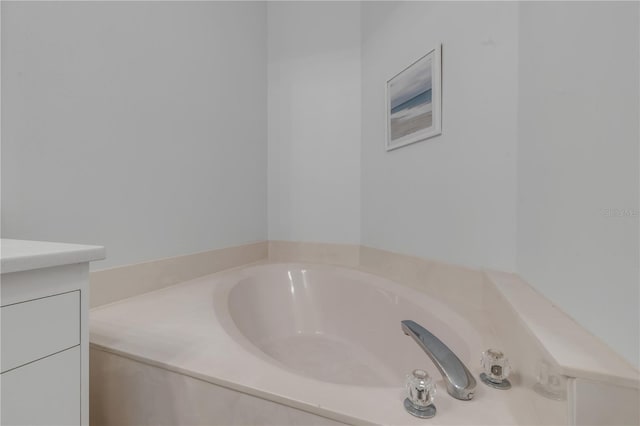 bathroom featuring vanity and a bathing tub