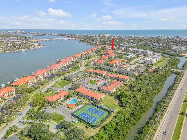 birds eye view of property with a water view