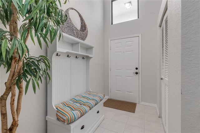 mudroom with light tile patterned floors