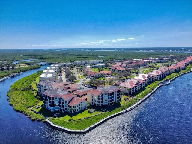 birds eye view of property with a water view