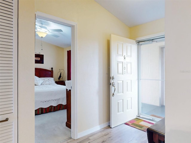 entrance foyer featuring light wood-type flooring and ceiling fan