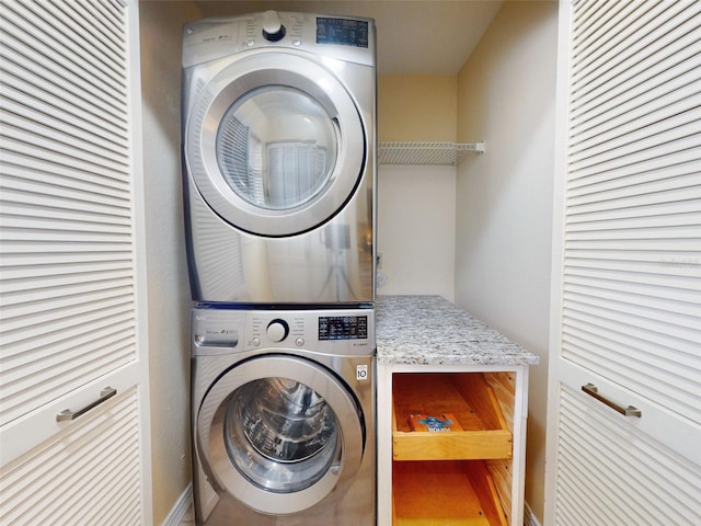 452 Bouchelle Dr Unit 303, New Smyrna Beach, FL 32169 - washroom featuring estacked washer and dryer