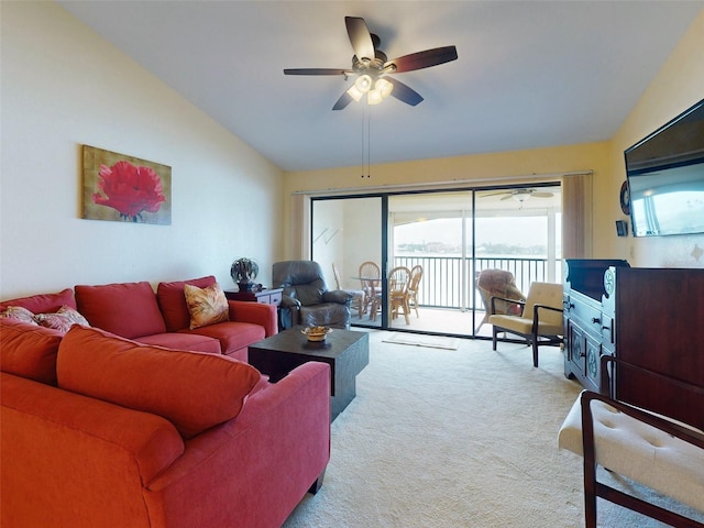 452 Bouchelle Dr Unit 303, New Smyrna Beach, FL 32169 - living room with lofted ceiling, carpet floors, and a ceiling fan