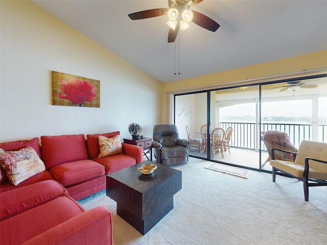 carpeted living room featuring ceiling fan and vaulted ceiling