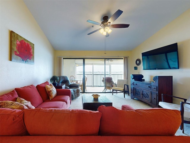 carpeted living room featuring lofted ceiling and ceiling fan