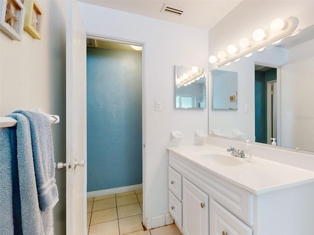 bathroom featuring tile patterned flooring and vanity