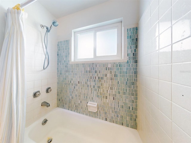 bathroom with shower / tub combo with curtain