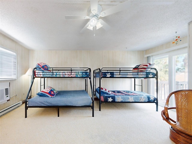 carpeted bedroom with ceiling fan and a textured ceiling