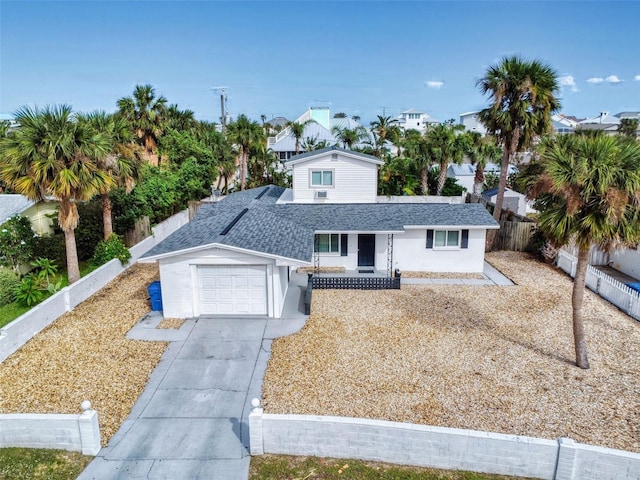 view of front of property with a garage