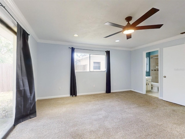 carpeted empty room with ceiling fan and ornamental molding