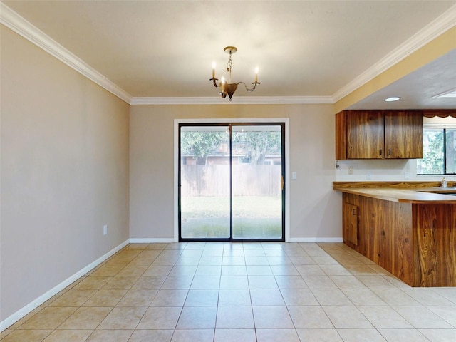 kitchen with a notable chandelier, decorative light fixtures, light tile patterned floors, and crown molding