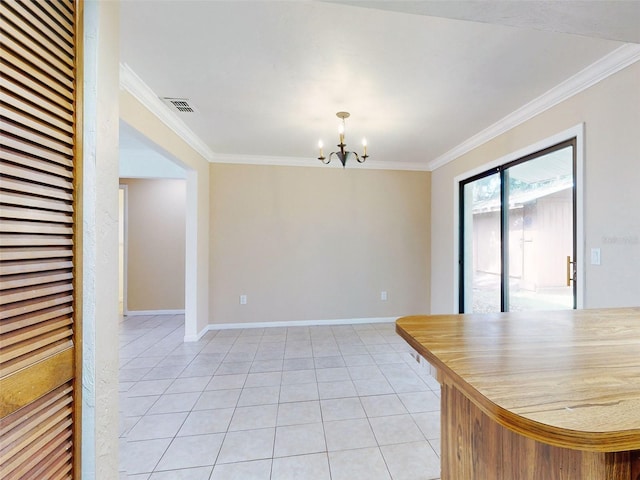 unfurnished dining area featuring crown molding, light tile patterned floors, and a chandelier