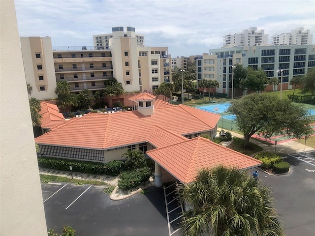 exterior space featuring a city view and uncovered parking