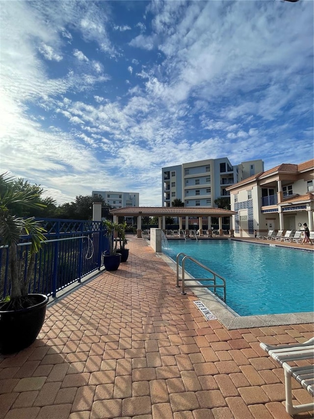 community pool featuring a patio area