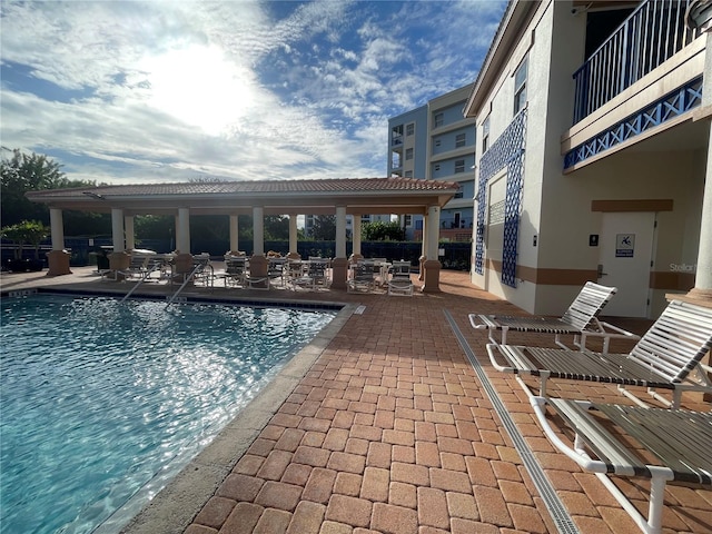 view of swimming pool featuring a patio