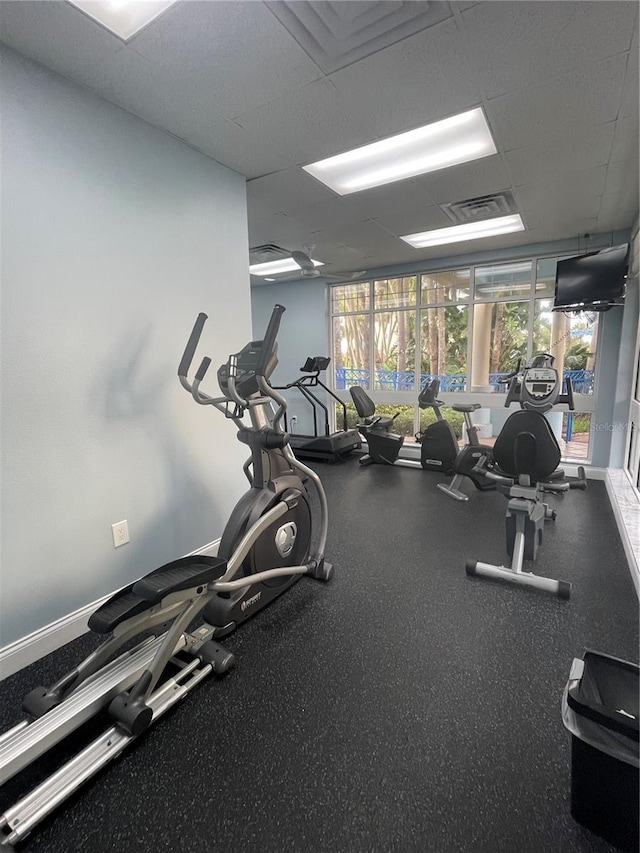 gym with a drop ceiling and visible vents