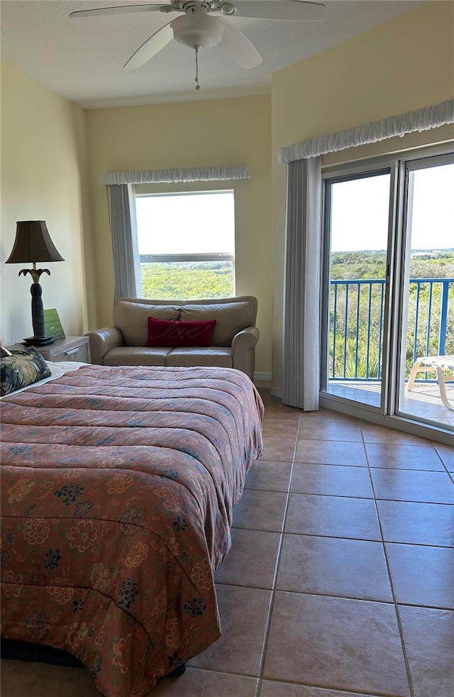 bedroom with tile patterned flooring, access to exterior, and ceiling fan